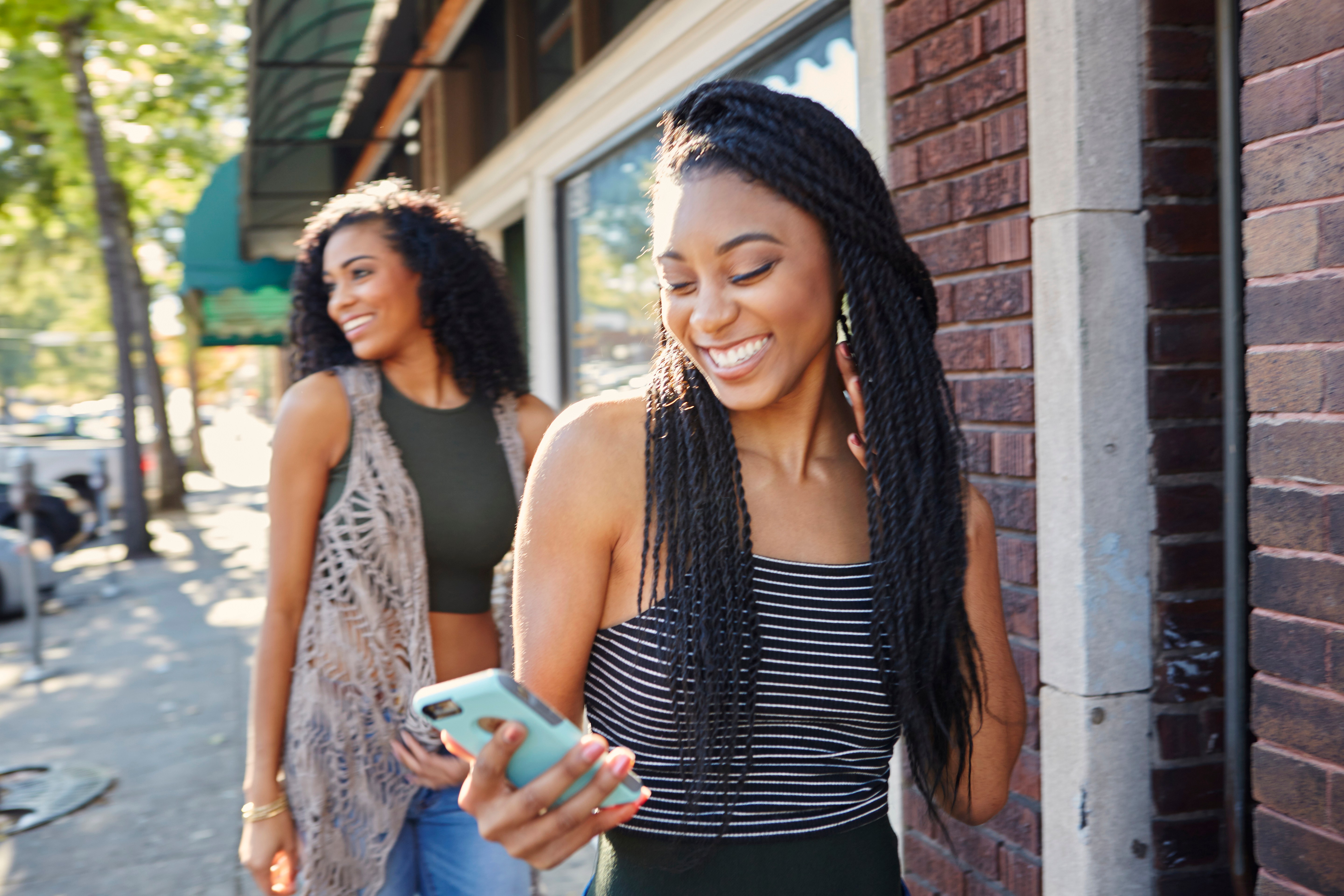 Young women explore a city