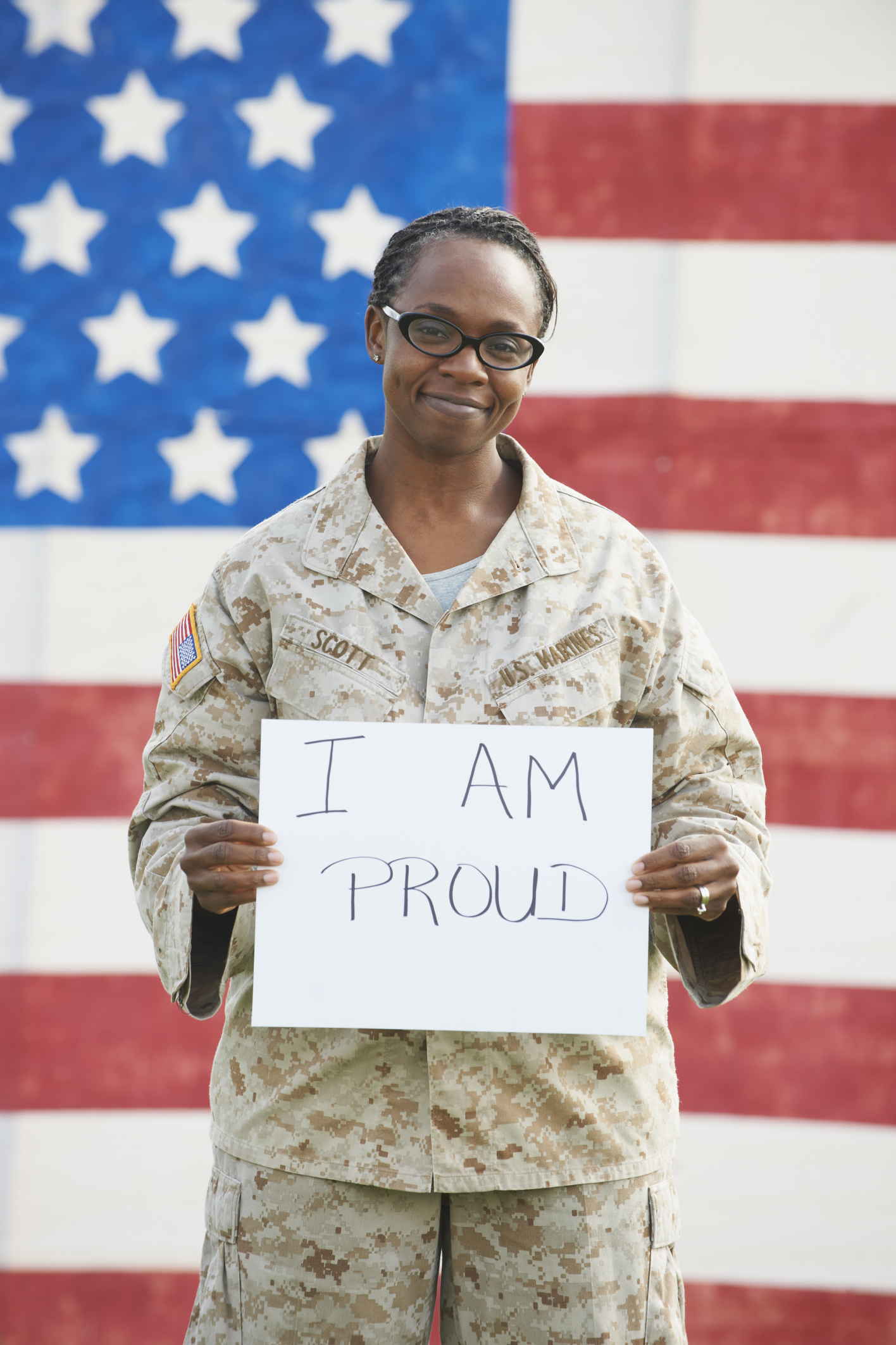 Black soldier holding empowering sign