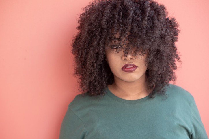Portrait Of Woman Against Pink Background