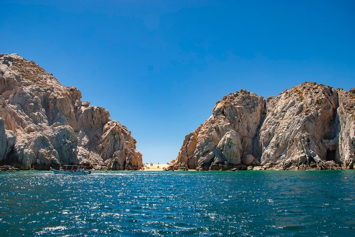 Scenic View Of Sea Against Clear Blue Sky
