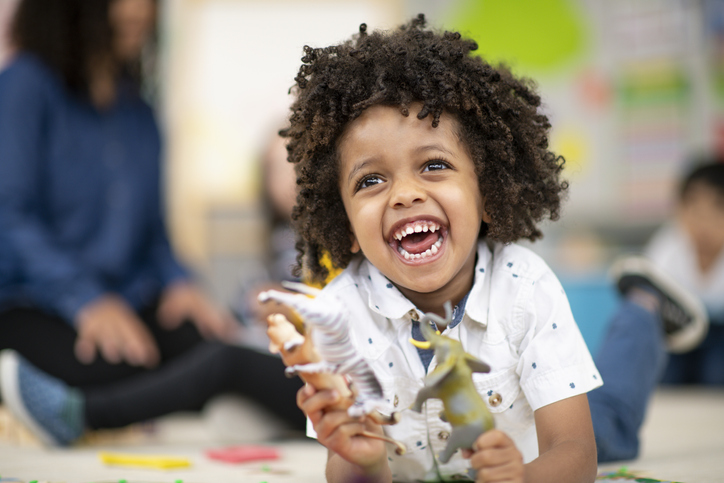 Creative preschool student playing