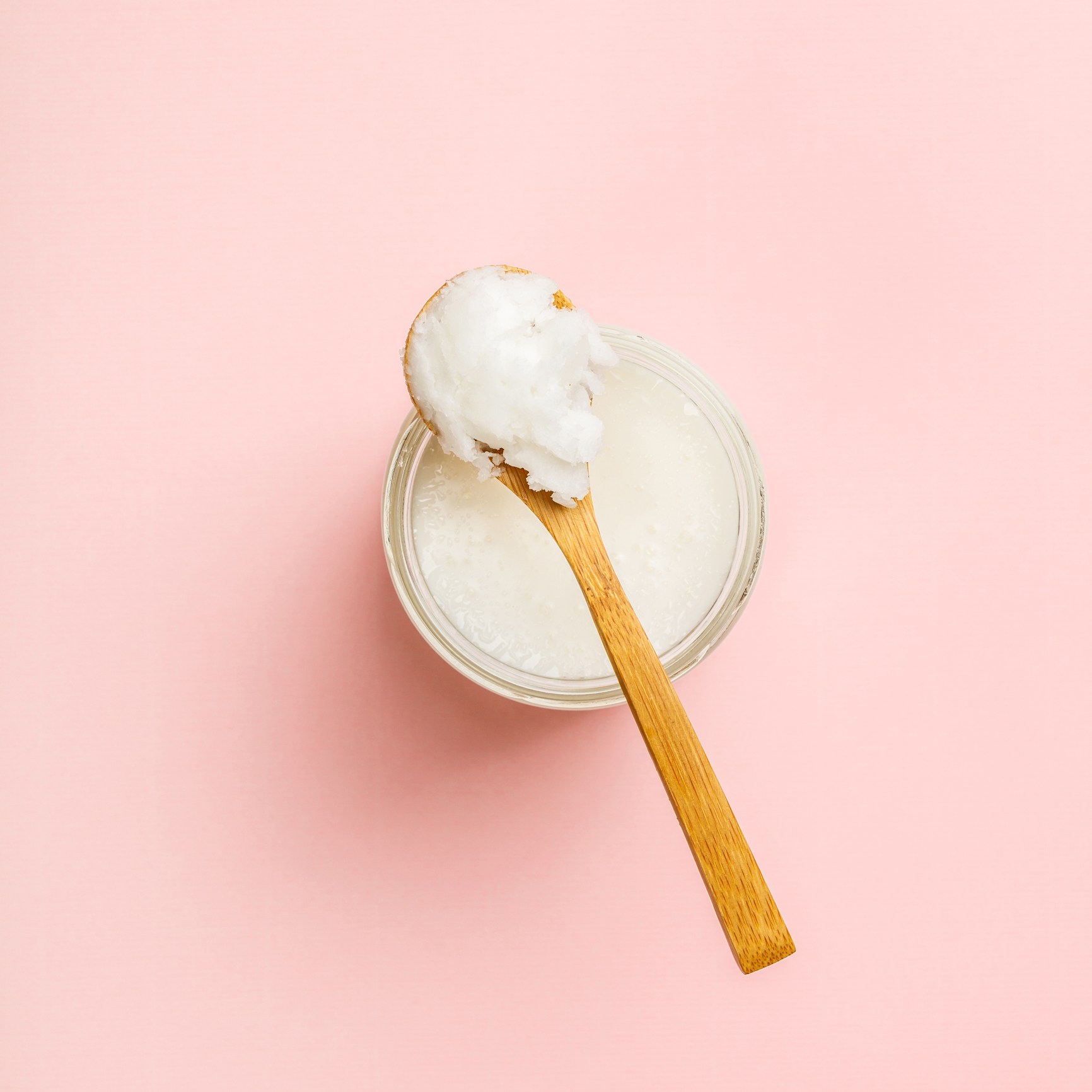 Directly Above Shot Of Cream In Container Against Pink Background