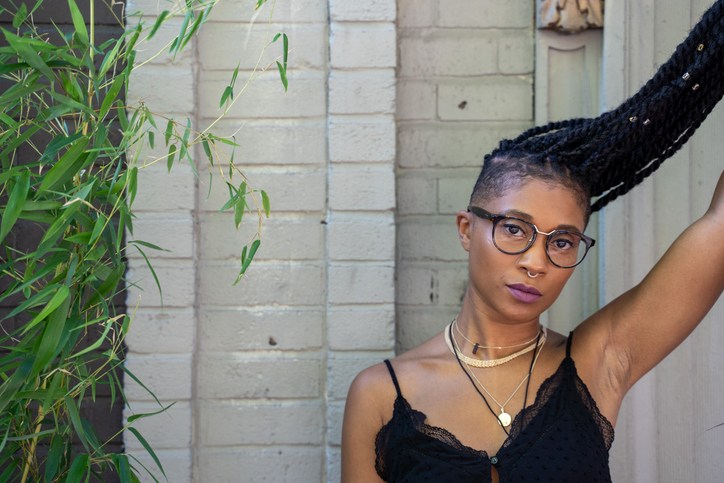 Portrait of stylish woman with braids