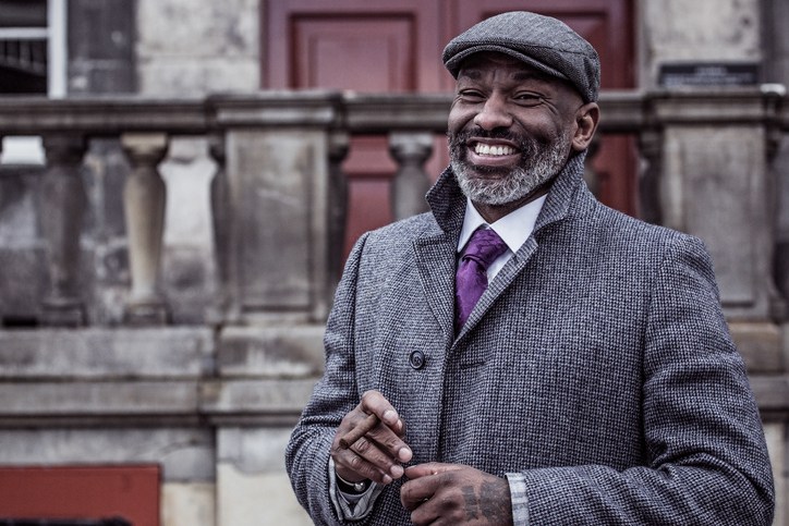 Portrait of a black vintage Gangster Man in an old city