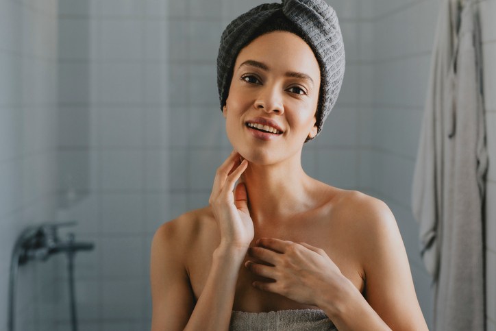 Beautiful African American Woman Wrapped in a Towel after Having a Shower