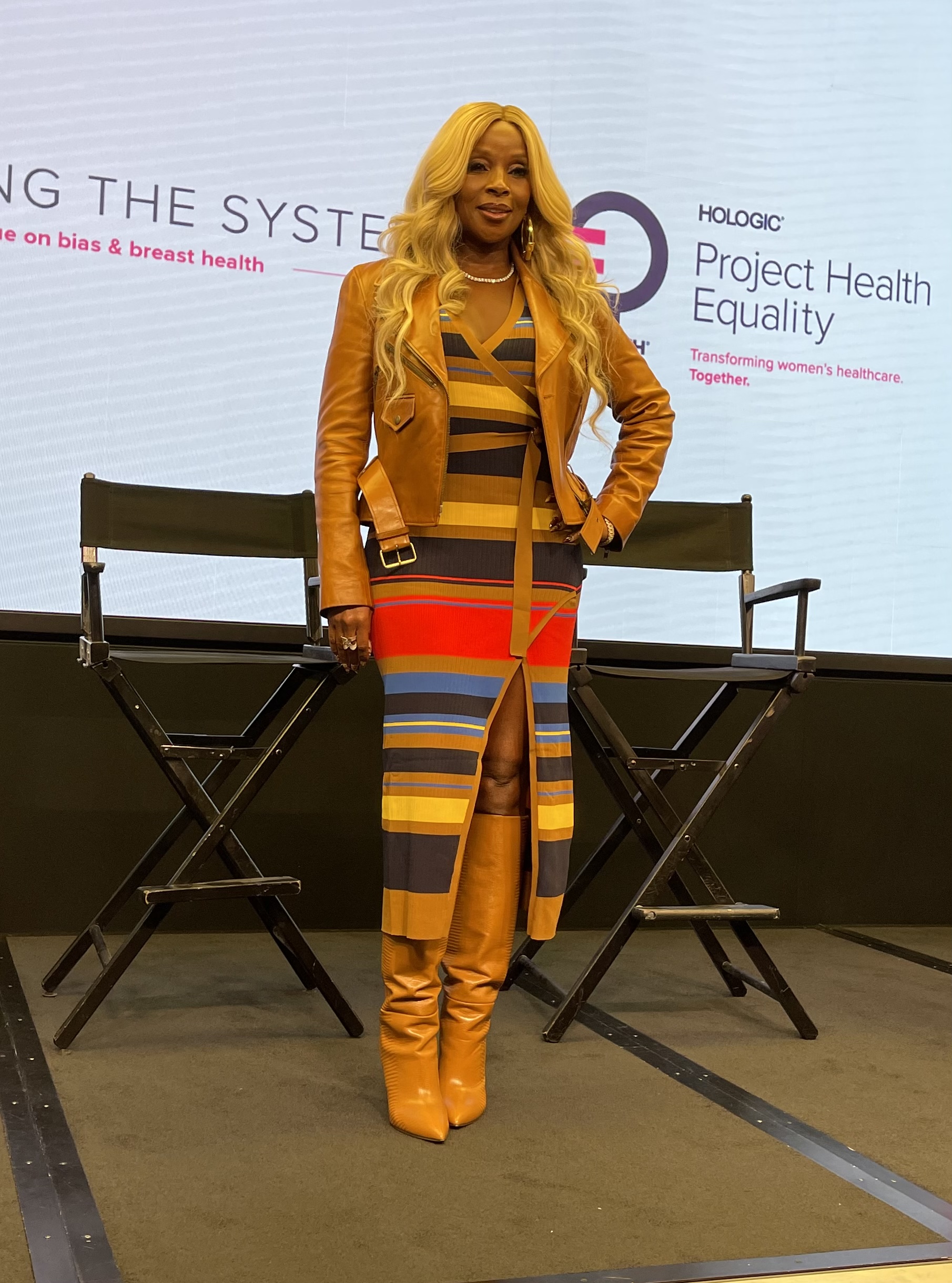 Mary J Blige in tan boots and striped dress at Breast Cancer panel