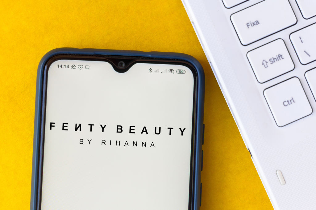 In this photo illustration the Fenty Beauty by Rihanna logo...