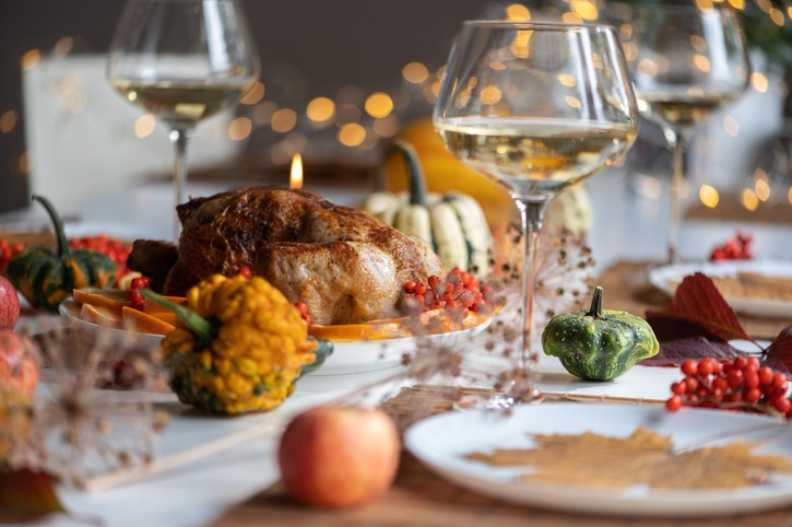 Traditional Festive Dinner With Delicious Roasted Turkey Served On Table