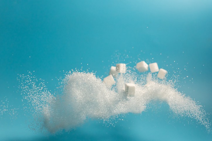 White sugar and cubes flying