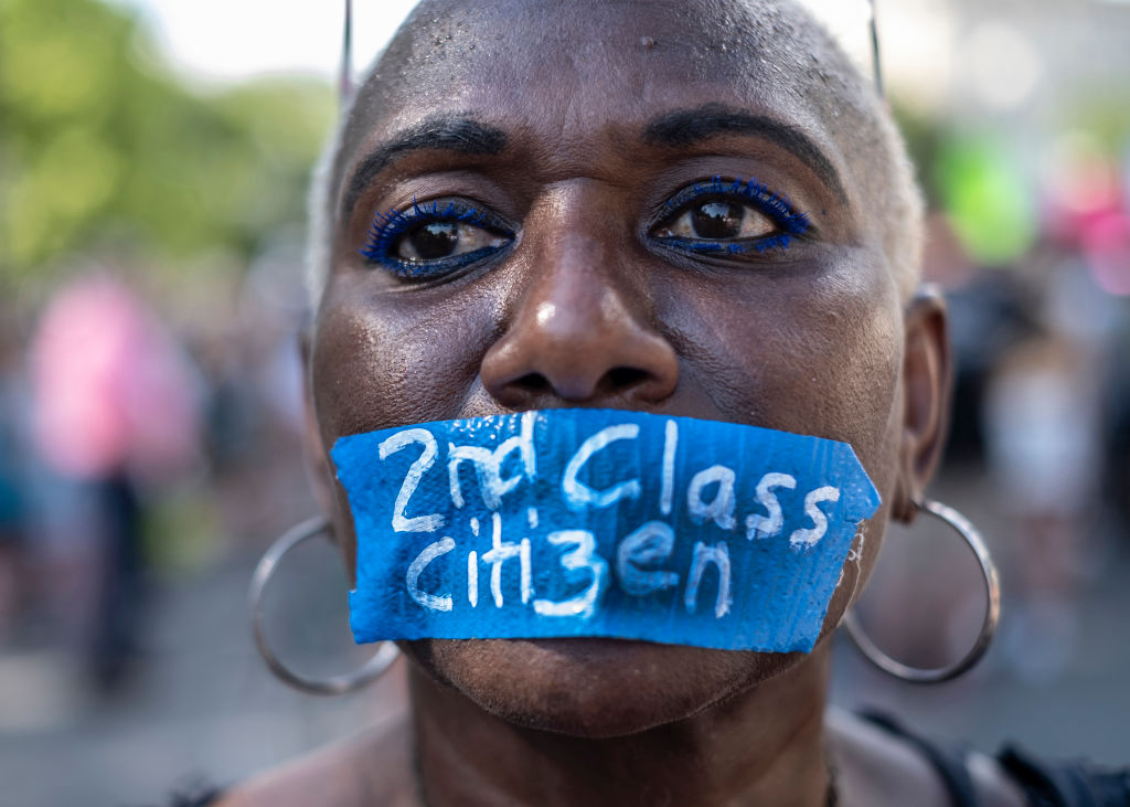An abortion rights activist Nadine Seiler wears tape on her...