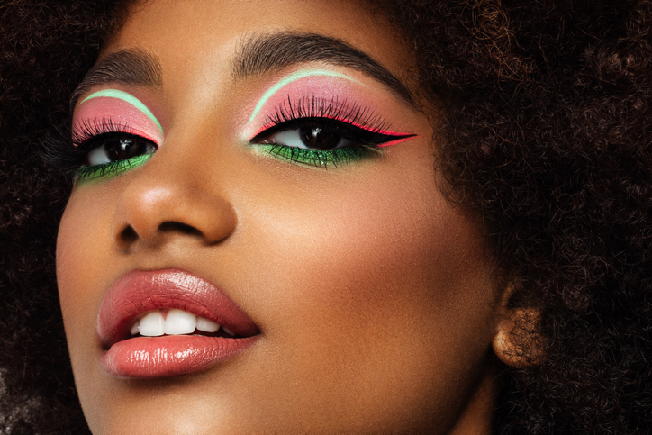 Portrait of young afro woman with bright make-up
