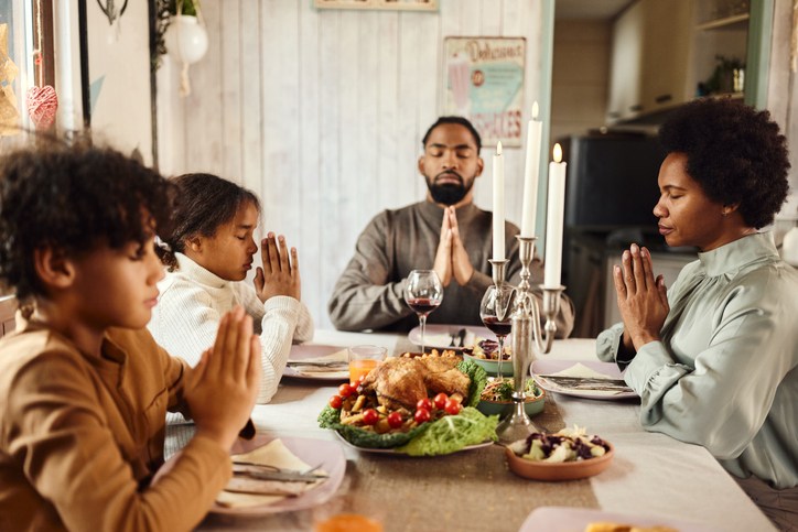 black family praying 