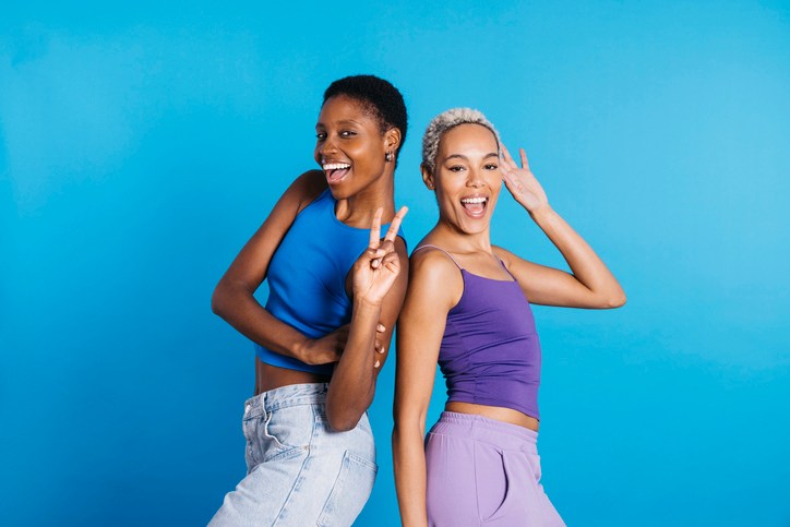 Two women dancing in a studio.