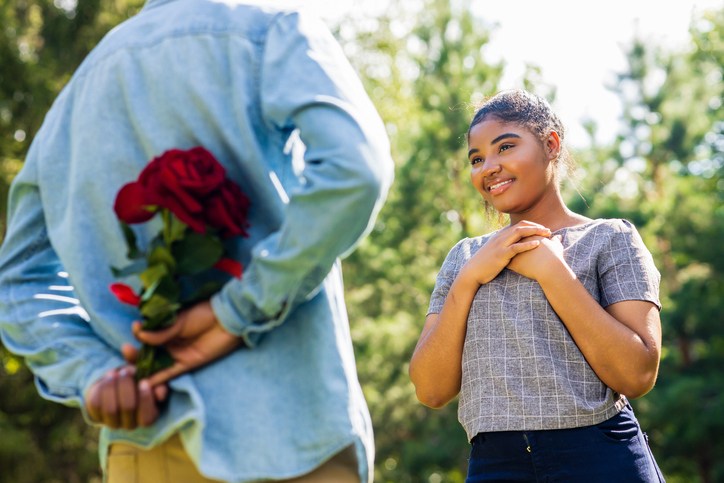 Smiling african couple at romantic picnic in summer park dation at sunny day