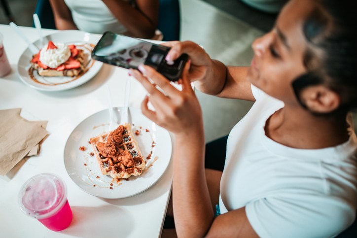 Young Women Photographing Brunch With Smartphones