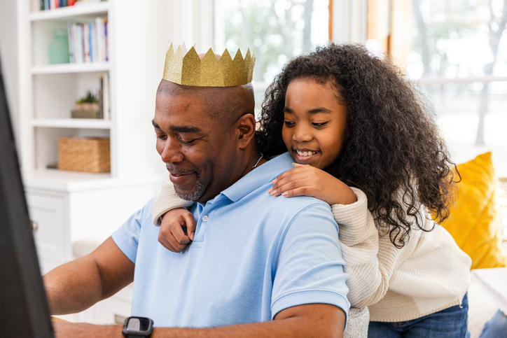 Grandfather and Granddaughter Bonding Over Technology