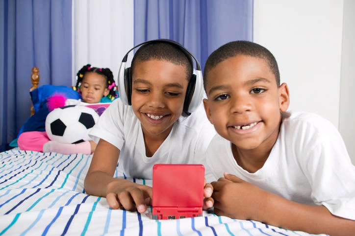 Two boys and a girl playing