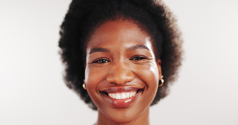 Dental, smile and portrait of black woman in studio for oral hygiene, self care or teeth whitening. Dentist cleaning, happiness and veneers with person on white background for gum health and wellness