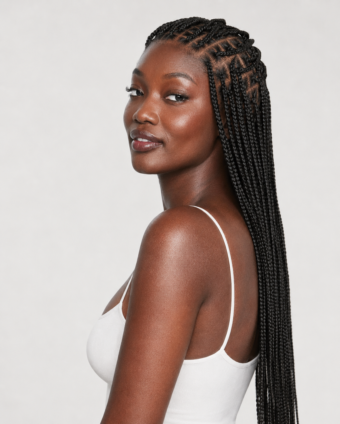 A model wearing the LuvMe Hair OwnScalp Braided Wig Knotless