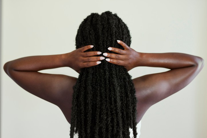 Back View of Woman with Long Black Textured Twists