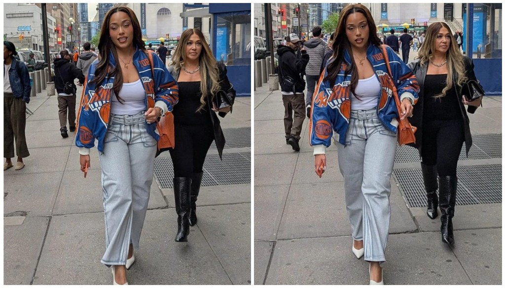 Jordyn Woods wearing Knicks jacket and orange bag