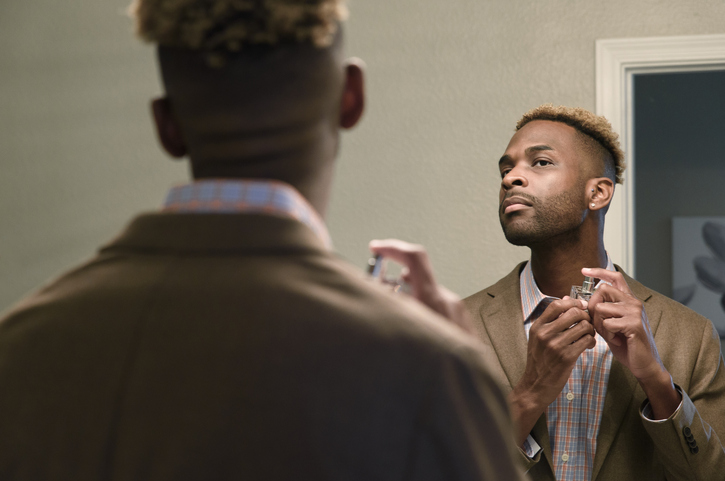 Man applying aftershave