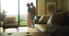 Love, kiss or couple in house with hug, partner affection or bonding together in connection. Tender, embrace or people with emotional security, romantic moment or commitment in healthy relationship.
